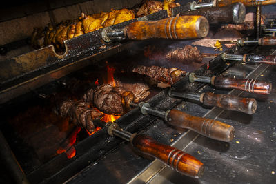 Brazilian style beef ribs barbecue grill on skewers at a churrascaria steakhouse in brazil.