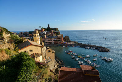 High angle view of sea and buildings against sky