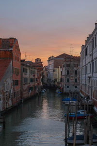 View of canal at sunset