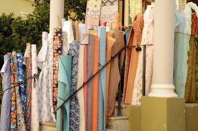 Row of multi colored umbrellas hanging at market stall