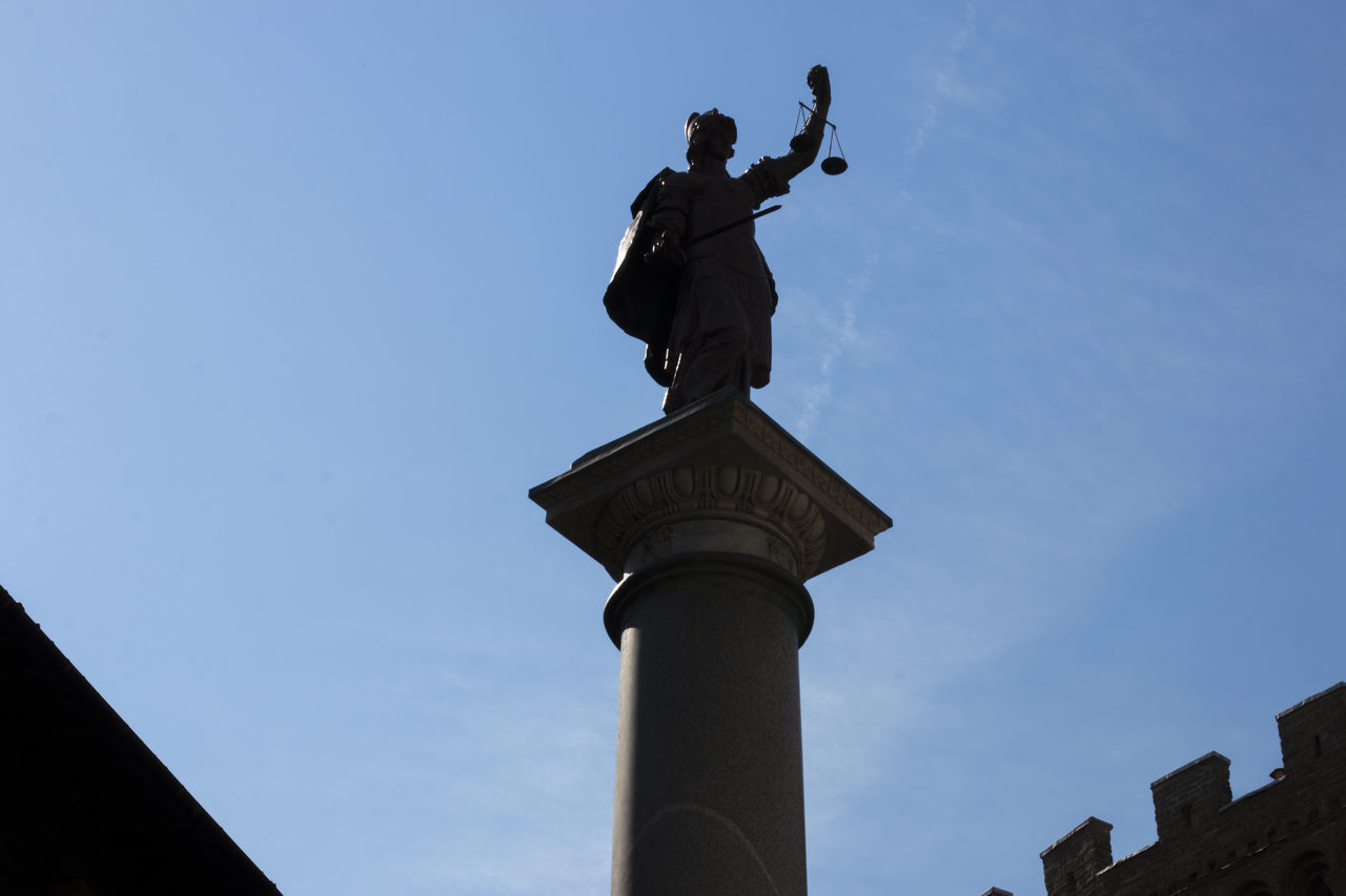 LOW ANGLE VIEW OF STATUE AGAINST THE SKY