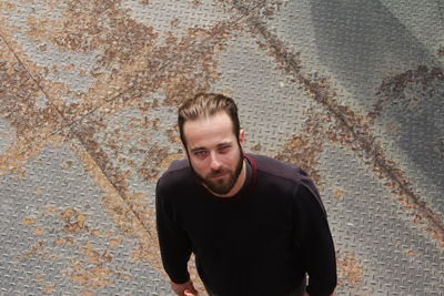 High angle portrait of man standing outdoors