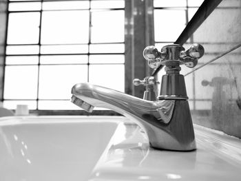 Close-up of faucet in bathroom