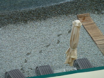 High angle view of deck chairs on beach