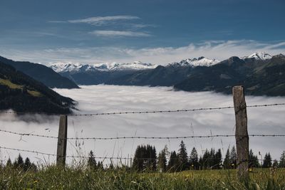 Scenic view of field against sky austria alps with a little fog