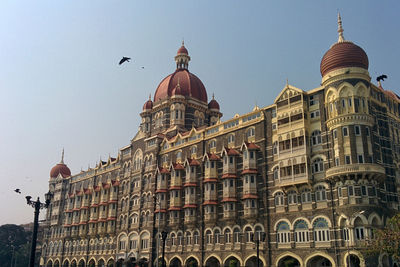 Low angle view of building against sky in city