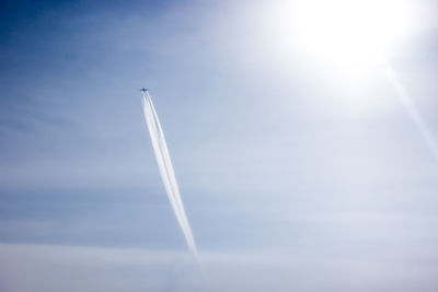 Low angle view of vapor trails in sky