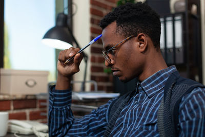 Close-up of businessman working at office