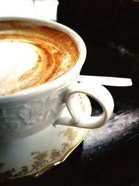 High angle view of cappuccino on table