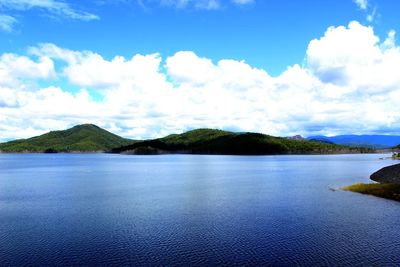 Scenic view of mountains against cloudy sky