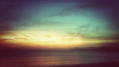 Scenic view of sea at sunset