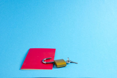 High angle view of flag on table against blue background