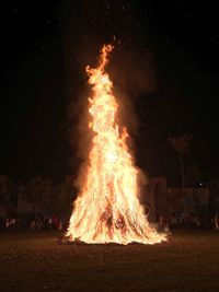 Bonfire on field at night