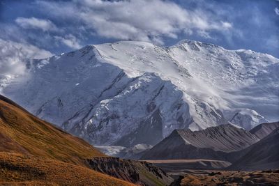 Scenic view of snowcapped mountains against sky