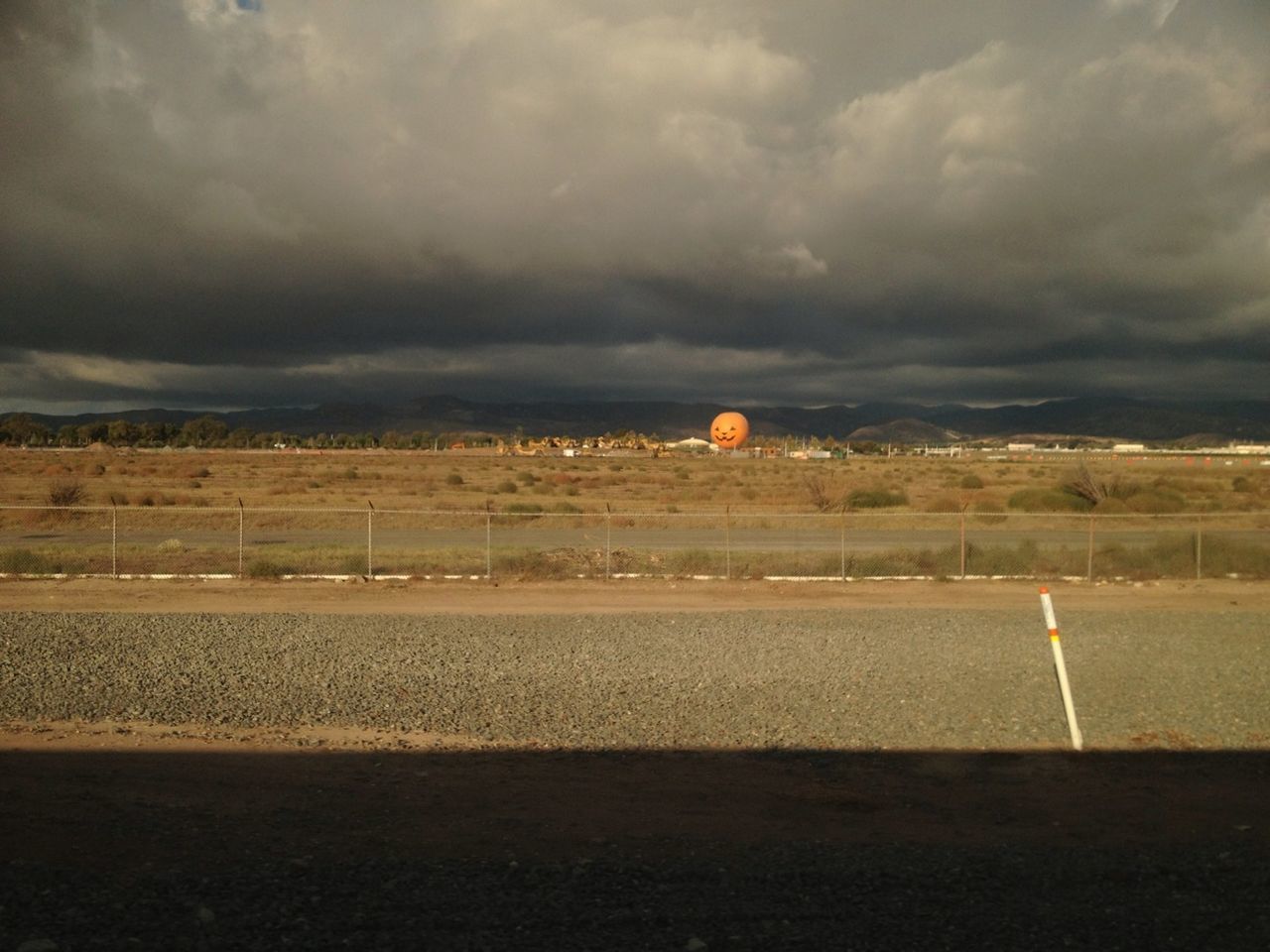 sky, cloud - sky, transportation, cloudy, road, weather, road marking, overcast, landscape, street, storm cloud, cloud, the way forward, dusk, dramatic sky, scenics, nature, tranquil scene, tranquility, outdoors