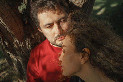 Close-up of couple embracing outdoors