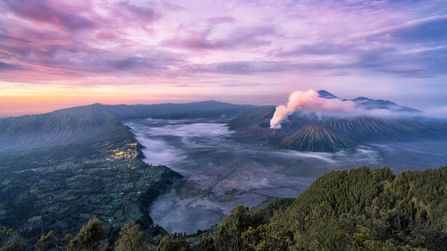 Panoramic view of volcanic landscape against sky during sunset