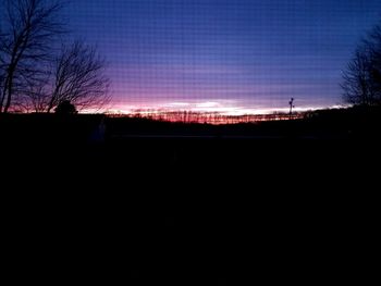 Silhouette landscape against sky during sunset