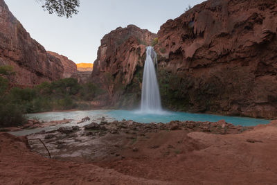 Scenic view of waterfall on mountain