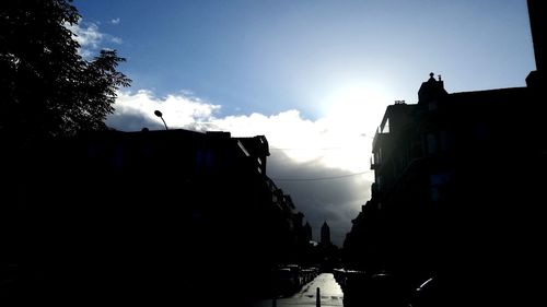 Silhouette of city against sky