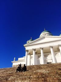 Low angle view of building against clear blue sky