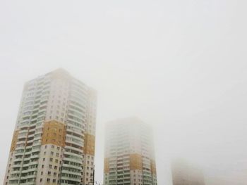 Skyscrapers in city against clear sky