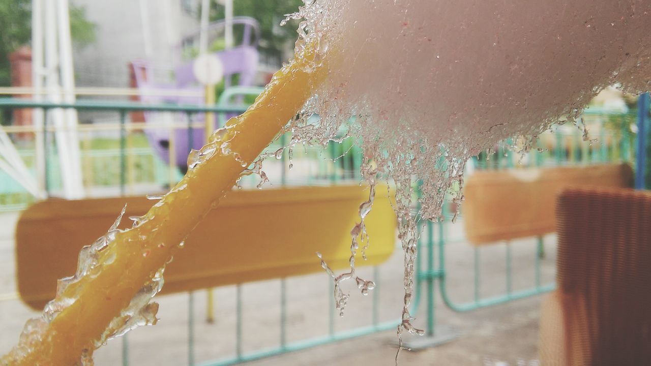 focus on foreground, close-up, hanging, window, drop, day, indoors, glass - material, built structure, wet, architecture, no people, season, cold temperature, water, transparent, building exterior, tree, selective focus