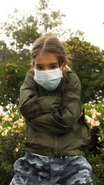 Portrait of a young woman standing outdoors