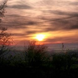 Scenic view of landscape against cloudy sky