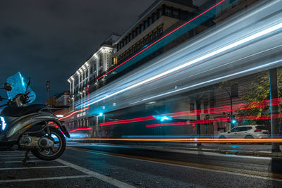 Light trails on road in city at night