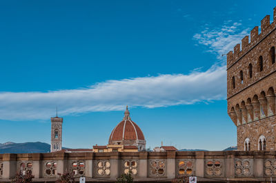 Buildings in city against sky