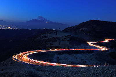 High angle view of light trails on road at night