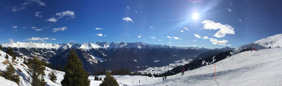 Scenic view of snowcapped mountains against sky