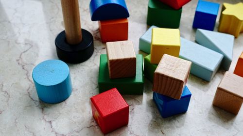 Close-up of multi colored toys on white background