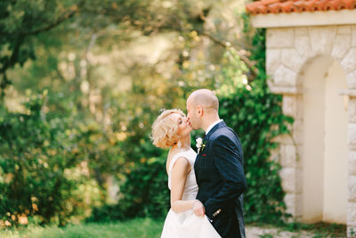 Rear view of couple standing outdoors