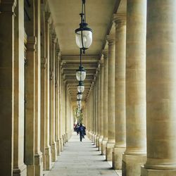 People walking in corridor of building