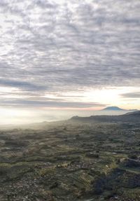 Scenic view of landscape against sky during sunset