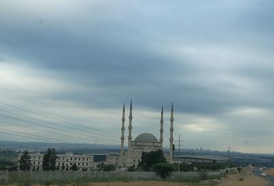 View of temple against cloudy sky