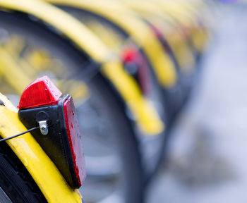 Close-up of bicycles on road