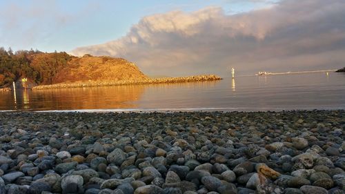 Scenic view of sea against sky at sunset