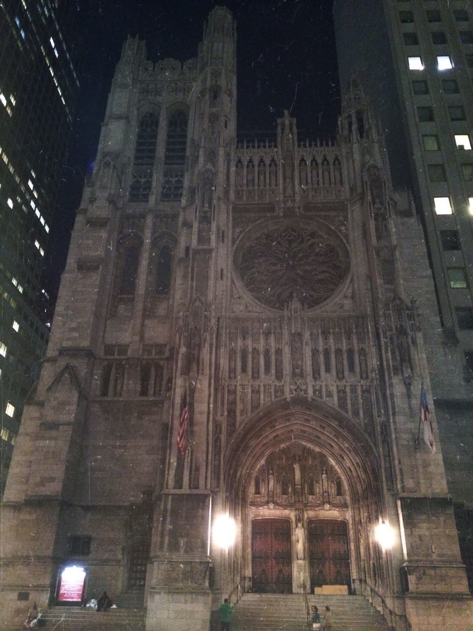 architecture, built structure, building exterior, low angle view, illuminated, night, arch, church, religion, history, window, building, city, lighting equipment, cathedral, no people, facade, place of worship