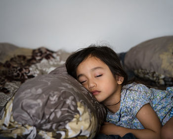 Cute girl relaxing on bed at home