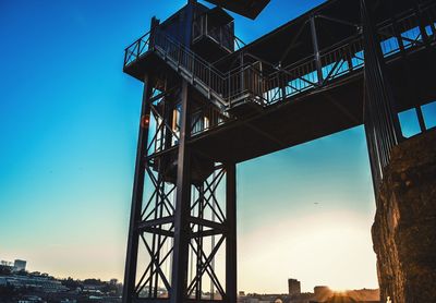 Low angle view of bridge against clear blue sky