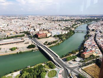 High angle view of river amidst buildings in city