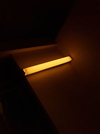 Low angle view of illuminated lamp at home