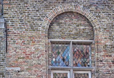 Window on brick wall of building