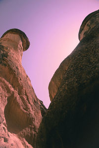 Low angle view of rock formation against sky