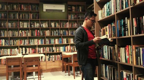 Full length of man standing on book