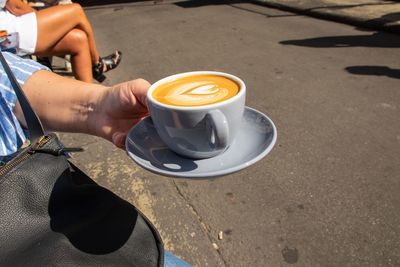 Woman holding coffee cup