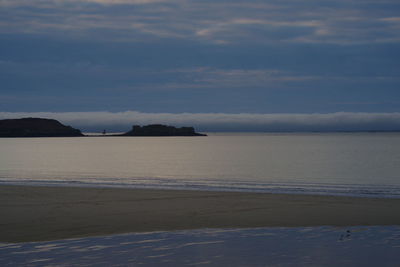 Scenic view of beach and sea against sky